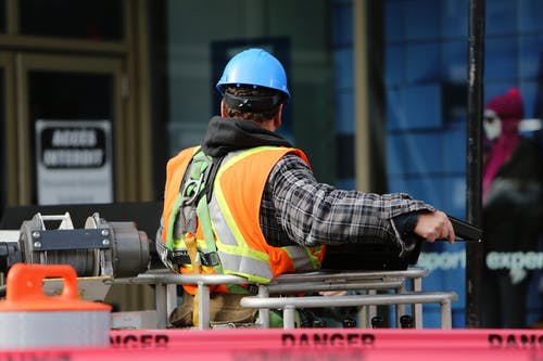 man wearing safety vest and hardhat