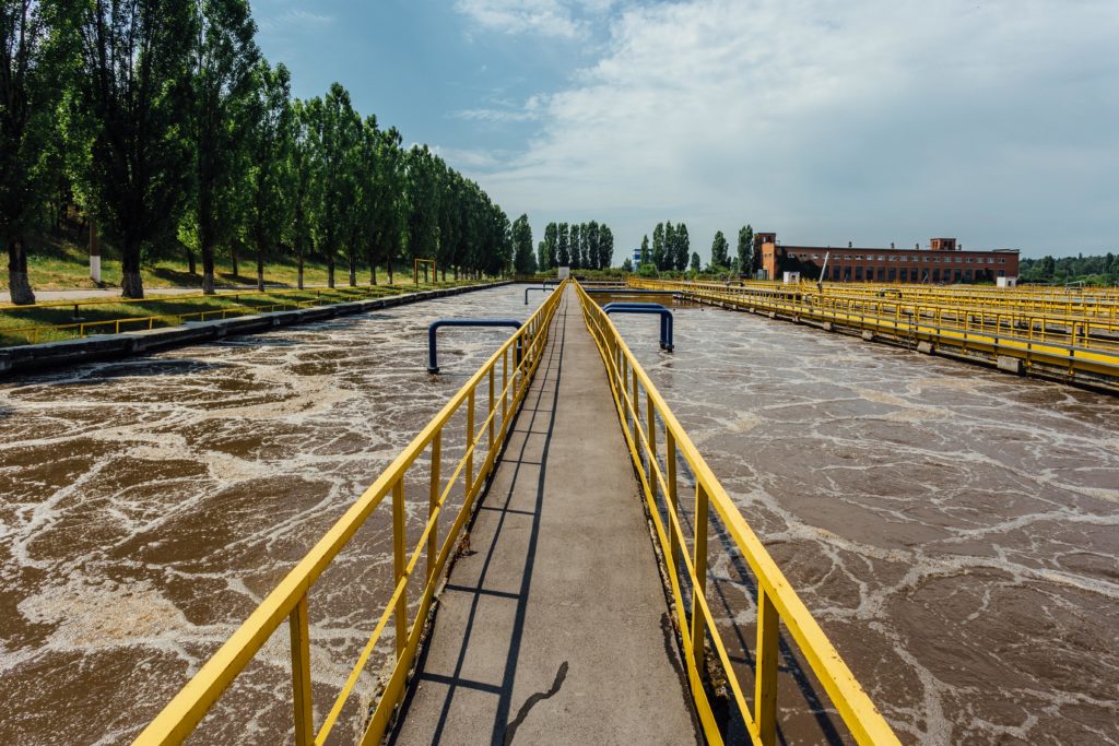 yellow walkway through wastewater treatment plant
